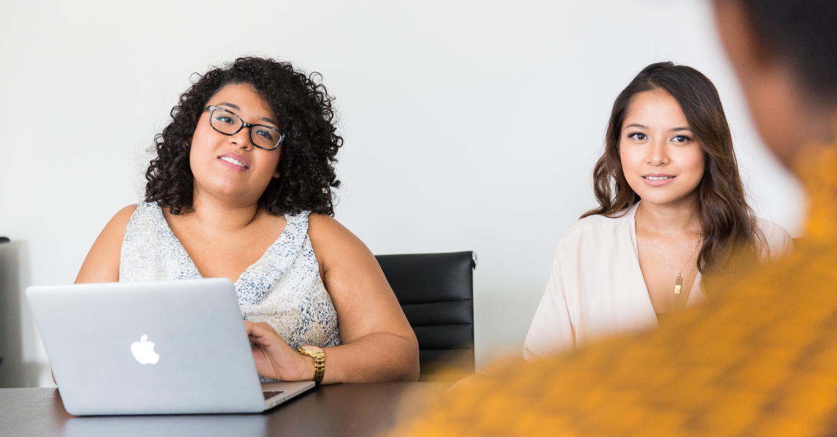 two women interviewing someone