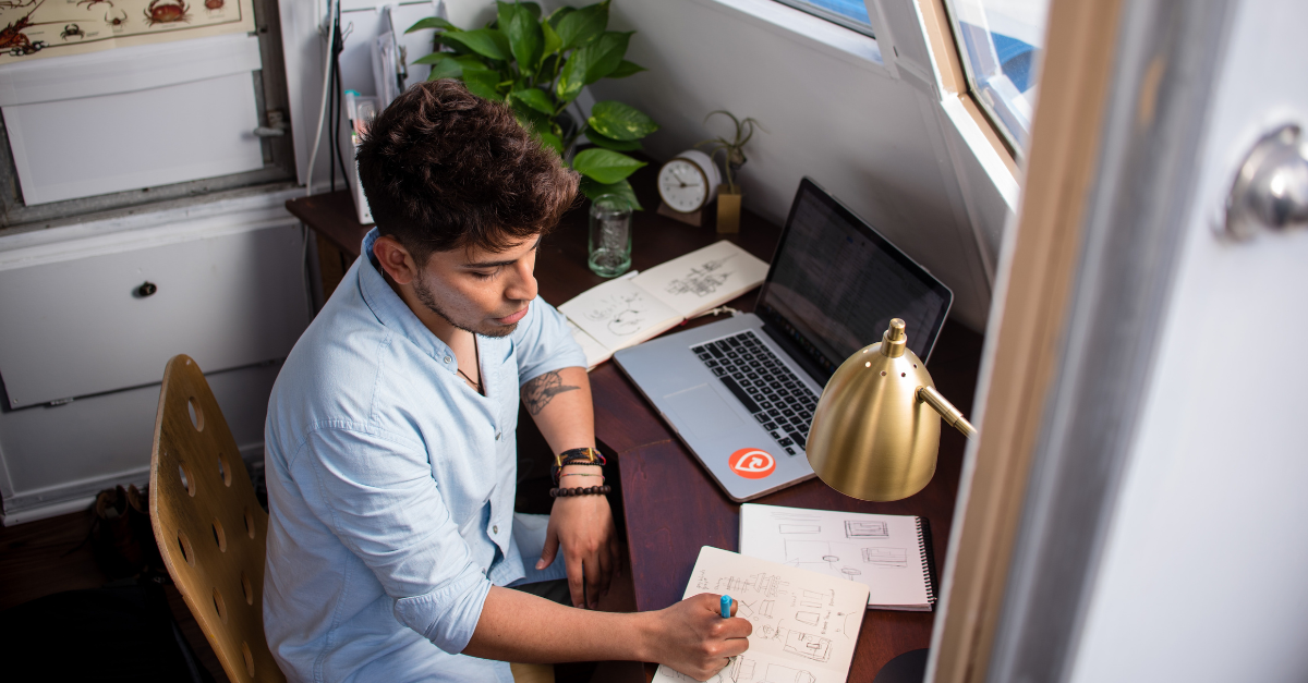 man working at desk from home