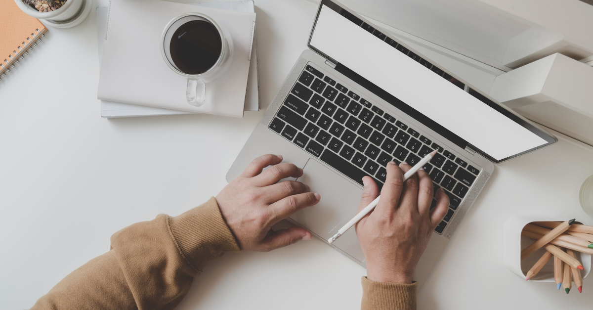 person typing at computer